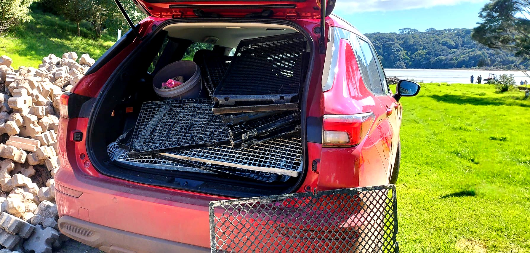 Rubbish removed from Te Matuku Bay foreshore loaded into a car